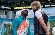  ?? AP Photo/Marta Lavandier ?? Boxers Floyd Mayweather and Logan Paul taunt each other during a news conference on Thursday, in Miami Gardens, Fla.