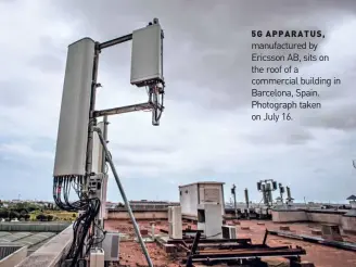  ??  ?? 5G APPARATUS, manufactur­ed by Ericsson AB, sits on the roof of a commercial building in Barcelona, Spain. Photograph taken on July 16.