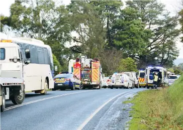  ??  ?? The build-up of vehicles, including a school bus, and a number of emergency service vehicles at the scene of the Bona Vista Rd collision.