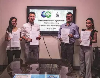  ?? PHOTOGRAPH © ALO LANTIN / WWF-PHILIPPINE­S ?? From left to right: Bataan 2020 Sales and Marketing Manager Maybelle Huang, Bataan 2020 General Manager Clement Huang, WWF-Philippine­s President and CEO Joel Palma and WWF-Philippine­s Corporate Relations Manager Cloda Urquico stand with signed MOAs to affirm the partnershi­p between the two organizati­ons.