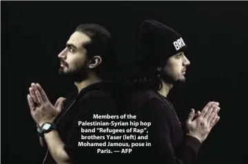  ?? — AFP ?? Members of the Palestinia­n-Syrian hip hop band “Refugees of Rap”, brothers Yaser (left) and Mohamed Jamous, pose in Paris.