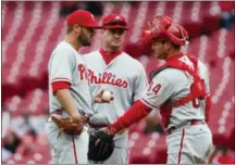  ?? JOHN MINCHILLO - AP ?? the third, Odubel Herrera doubled, advanced on a groundout and scored on a wild pitch, aided by Davis’ failure to cover the plate.
Clay Buchholz, who came to the Phillies last December for infielder Josh Tobias, couldn’t hold the lead. The Reds tied...