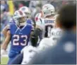  ?? ADRIAN KRAUS — THE ASSOCIATED PRESS ?? Bills safety Micah Hyde (23) argues with New England tight end Rob Gronkowski (87) Sunday in Orchard Park, N.Y.