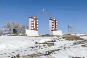  ?? Kalle Benallie / Indian Country Today photo via AP ?? The Wounded Knee Memorial, which marks the site of the massacre of hundreds of Lakota people by U.S. soldiers in 1890, is seen on Feb. 10, in Wounded Knee, S.D. A ceremony marking the 50 years since the occupation of Wounded Knee by American Indian Movement activists was held at the site on Monday, after four days of events leading up to the anniversar­y.