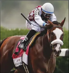  ??  ?? FAVORED
In this June 20 photo, Tiz the Law (8), with jockey Manny Franco up, approaches the finish line on his way to win the152nd running of the Belmont Stakes horse race in Elmont, N.Y.