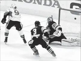  ?? Matt Kincaid Getty Images ?? BOBBY RYAN of Ottawa scores the game winner against Pittsburgh goalie Marc-Andre Fleury during overtime of Game 1 on Saturday.