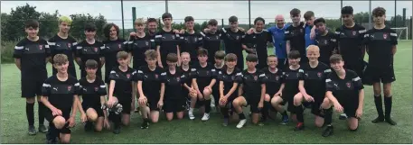 ??  ?? A Wexford Developmen­t Centre group with Chesterfie­ld F.C. Academy manager Neil Cluxton.