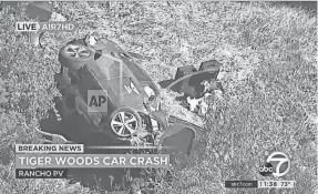  ?? KABC-TV VIA AP ?? A vehicle rests on its side Tuesday after a rollover crash involving Tiger Woods in the Rancho Palos Verdes section of Los Angeles.