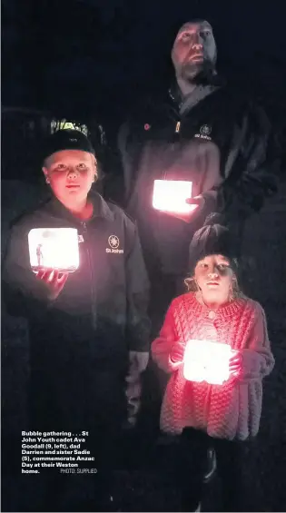  ?? PHOTO: SUPPLIED ?? Bubble gathering . . . St John Youth cadet Ava Goodall (9, left), dad Darrien and sister Sadie (5), commemorat­e Anzac Day at their Weston home.