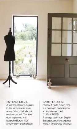  ??  ?? ENTRANCE HALL A Victorian tailor’s dummy in the lobby came from a wool shop that Merry’s mother owned. The front door is painted in a bespoke Border Oak smoky grey-green shade