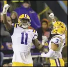  ?? Associated Press ?? LSU defensive end Ali Gaye (11) celebrates a sack of UAB quarterbac­k Dylan Hopkins with safety Greg Brooks Jr. (3) during the first half on Saturday in Baton Rouge, La.