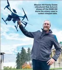  ?? STEVE MACNAULL/The Okanagan Weekend ?? Mission Hill Family Estate viticultur­ist Rob Achurch shows off the DGIM 200 drone the winery uses to collect vineyard data.
