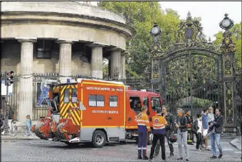  ?? FRANCOIS MORI/THE ASSOCIATED PRESS ?? A firetruck is parked at the entrance to Monceau parc in the center of Paris on Saturday after a lightning bolt crashed down onto a park, striking 11 people at a child’s birthday party.