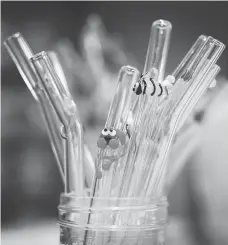  ??  ?? Glasssippe­r’s borosilica­te glass straws feature colourful critter decoration­s. The company has seen a large increase in sales since several businesses and cities have phased out or banned the use of plastic straws.