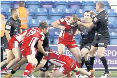  ?? Craig Galloway ?? Punches fly between Salford’s Craig Kopczak and Widnes’s Jack Buchanan – both are heading for the sin bin.