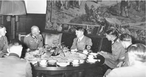  ?? ?? ABOVE: Adolf Hitler at table in the Berghof, his house on the Obersalzbe­rg in Bavaria; did talk turn to the Roman Empire, or was it the occasion for an anti-Christian rant?