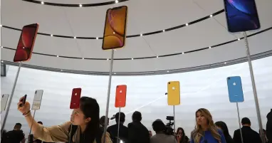  ?? — AFP ?? The new Apple iPhone XR is displayed during an Apple special event at the Steve Jobs Theatre in Cupertino, California.