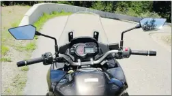  ??  ?? The gauges of the Versys 1000 offer the rider digital displays of speed, total distance, fuel consumptio­n, time and temperatur­e, while an analog tach red- lines at 10,000 rpm. The on- board computer is controlled from the left handlebar, and the...