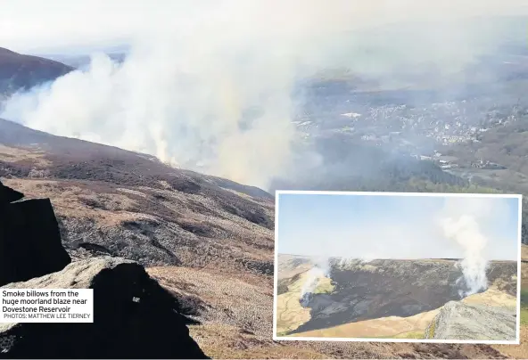  ??  ?? Smoke billows from the huge moorland blaze near Dovestone Reservoir