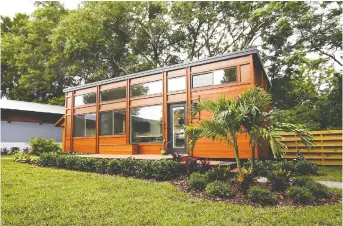  ??  ?? Judie Clark was able to pay cash for her tiny house at Tampa Bay Village. It is about 400 square feet on one level.