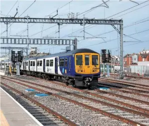  ?? ROBERT FRANCE. ?? On May 20, Northern 319424 leaves Blackpool North with the 0843 to Manchester Airport. This was the first passenger-carrying electric train to depart the seaside town. The operator’s services on this route have been decimated following the introducti­on...