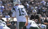  ?? JOSE CARLOS FAJARDO — STAFF ARCHIVES ?? Raiders cornerback David Amerson, right, is not officially ruled out of Sunday’s game versus the Patriots, but his return is unlikely.