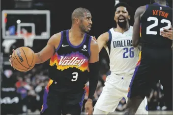  ?? MATT YORK/AP ?? PHOENIX SUNS GUARD CHRIS PAUL (3) looks to pass against the Dallas Mavericks during the first half of Game 7 of a Western Conference playoff semifinal on Sunday in Phoenix.