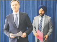  ?? FRANK GUNN / THE CANADIAN PRESS FILES ?? Two days after it occurred, Finance Minister
Bill Morneau, left, and Industry Minister Navdeep Bains said they were determined to find out how
informatio­n got out early.