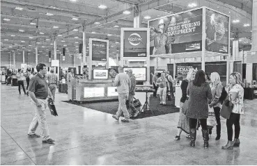  ??  ?? Participan­ts gather for the Oklahoma Oil and Gas Expo at State Fair Park’s Bennett Center on Thursday.