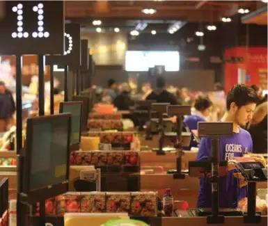  ?? STEVE RUSSELL/TORONTO STAR FILE PHOTO ?? Ontario corporatio­ns that employ many low-wage workers, like these checkout clerks at Loblaws, can well afford to pay them $15 an hour, Toby Sanger argues. "What (critics) haven’t mentioned is that corporate profits in Ontario are at record levels."