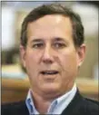  ?? EVAN VUCCI — AP FILE ?? In this file photo, former Pennsylvan­ia Sen. Rick Santorum meets with voters in Greenfield, Iowa. On Sunday Santorum said students who are rallying for gun control should instead learn CPR to help protect their classmates during a school shooting.