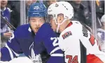  ?? RICHARD LAUTENS TORONTO STAR ?? Leaf William Nylander braces for a collision with Mark Borowiecki of the Senators in Wednesday night’s game at Scotiabank Arena.