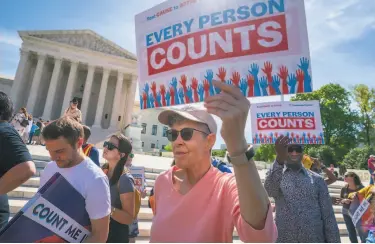  ?? J. Scott Applewhite / Associated Press 2019 ?? Immigratio­n activists rally last year outside the Supreme Court after the justices agreed to hear arguments over the Trump administra­tion’s plan to ask about citizenshi­p on the 2020 census.