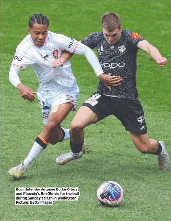  ?? ?? Roar defender Antonee Burke-Gilroy and Phoenix’s Ben Old vie for the ball during Sunday’s clash in Wellington. Picture: Getty Images