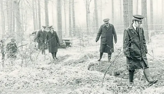  ??  ?? Police in Templeton Woods following the discovery of the body in 1980.