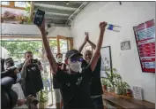  ?? SAKCHAI LALIT — THE ASSOCIATED PRESS ?? Rittipomng Bachkul, celebrates after buying legal marijuana at the Highland Cafe in Bangkok, Thailand, on Thursday.