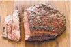  ?? AMERICA’S TEST KITCHEN VIA AP ?? Serve grilled flank steak with an easy garlic-herb sauce for a casual backyard barbecue.