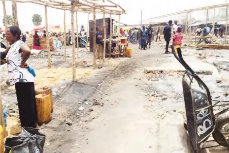  ?? PHOTOS: Lami Sadiq ?? A section of the market engulfed by fire last Friday night