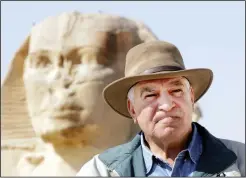  ?? (File Photo/AP/Amr Nabil) ?? Zahi Hawass, former general secretary of the Superior Council of Antiquitie­s of the Egyptian government, poses March 3, 2007, in front of Sphinx in Giza, Egypt. Hawass has put forth a petition, which has more than 100,000 signatures, calling for the return to Egypt of the Rosetta stone.