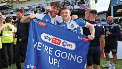  ?? ?? Antony Evans and Elliot Anderson celebrate promotion
Picture: Bradley Collyer/PA