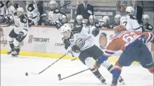  ?? JASON MALLOY/ THE GUARDIAN ?? Charlottet­own Islanders defenceman Hunter Drew, left, makes a move on Moncton Wildcats blue- liner Daniil Miromanov Sunday during Quebec Major Junior Hockey League action at the Eastlink Centre.