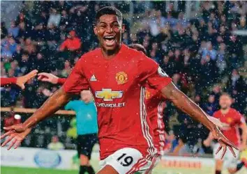  ?? AFP ?? Manchester United’s striker Marcus Rashford celebrates after scoring a late winning goal during the English Premier League match against Hull City at the KCOM Stadium in Kingston upon Hull, north east England.