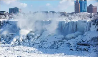  ?? TARA WALTON CANADIAN PRESS ?? WATER flows over the frozen American Falls, seen from the Canadian side in Niagara Falls, Ontario this week. |