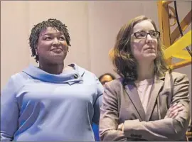  ?? Alyssa Pointer Atlanta Journal-Constituti­on ?? DEMOCRATIC candidate Stacey Abrams, left, with campaign manager Lauren Groh-Wargo, has activated a legal team to ensure “that every ballot is counted.”