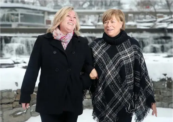  ?? JULIE OLIVER • POSTMEDIA NEWS ?? Sisters Allison Vaughan, left, and Linda Julian have been with the Ottawa Senators since the beginning.