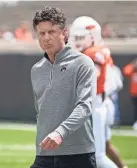  ?? SUE OGROCKI/AP ?? What will the new Big 12 Conference look like for Oklahoma State coach Mike Gundy and the Cowboys?