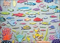  ?? PHOTOS: PIKE PLACE MARKET ?? Public art, like this tile fish wall by longtime Market artist Clare Dohna, gives Pike Place much-needed pops of color in the landings of the grand staircase leading to the new MarketFron­t plaza.