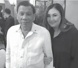  ??  ?? MEGASTAR IN THE PALACE – President Duterte and Megastar Sharon Cuneta share a light moment during dinner Tuesday evening at Malacanang Palace. This photo was shared by Special Assistant to the President Christophe­r ‘Bong’ Go in his social media page.