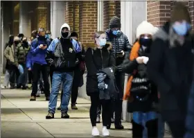  ?? MATT ROURKE — THE ASSOCIATED PRESS ?? People wait in line Feb. 3 at a COVID-19 vaccinatio­n site at the Pennsylvan­ia Convention Center in Philadelph­ia. The clinic opened to help provide second doses of COVID-19 vaccinatio­ns.