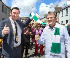  ??  ?? NO PLACE LIKE HOME: Above, Galway Mayor Mike Cubbard welcomes home Paddy Grant, while below, Mary Flanagan and Greg Cotter got the music going on St John’s Terrace